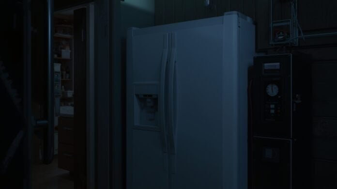 Refrigerator with temperature monitor powered by a battery backup during a home power outage